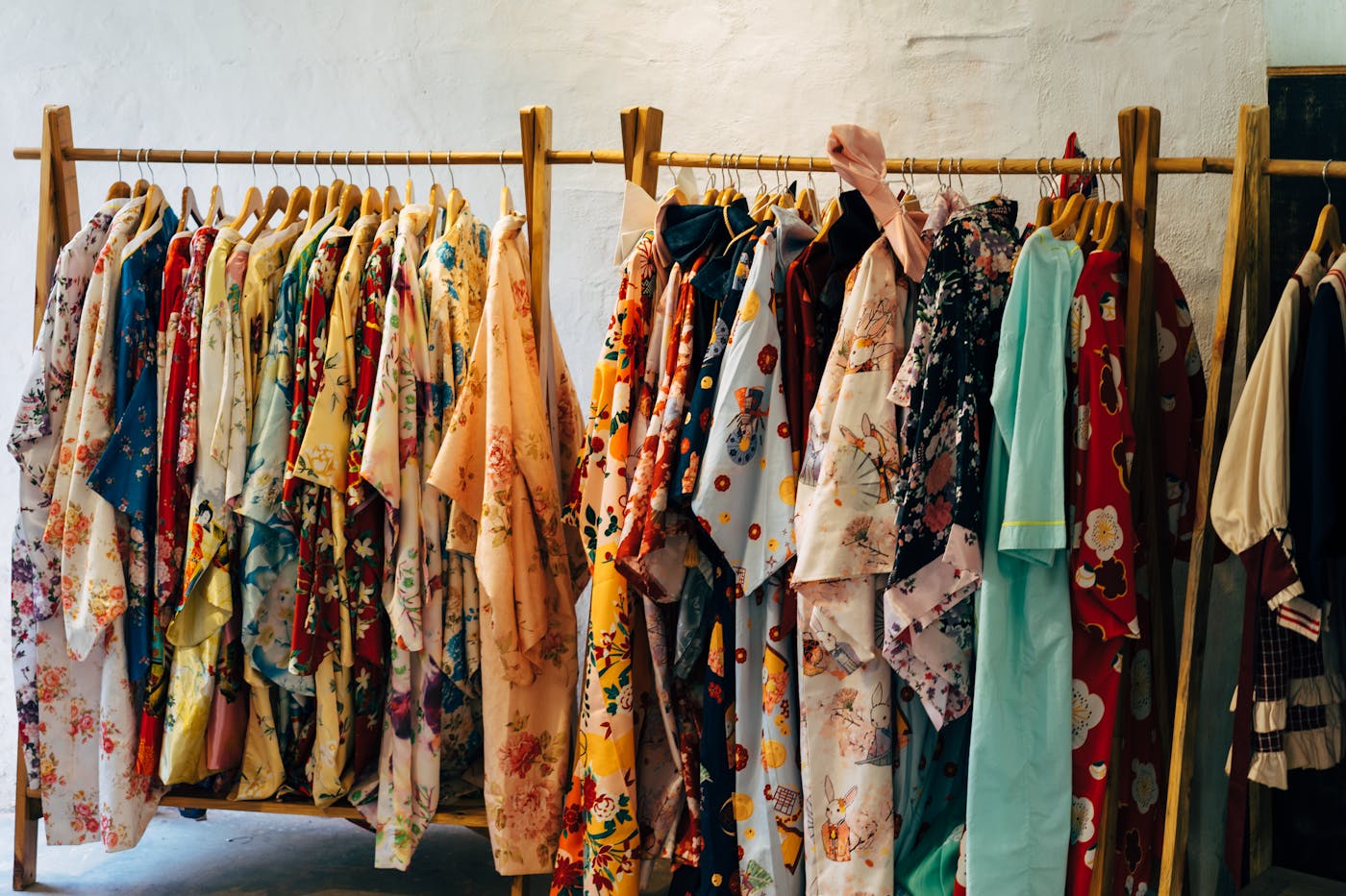 Curated rack of colorful outfits in a boutique.